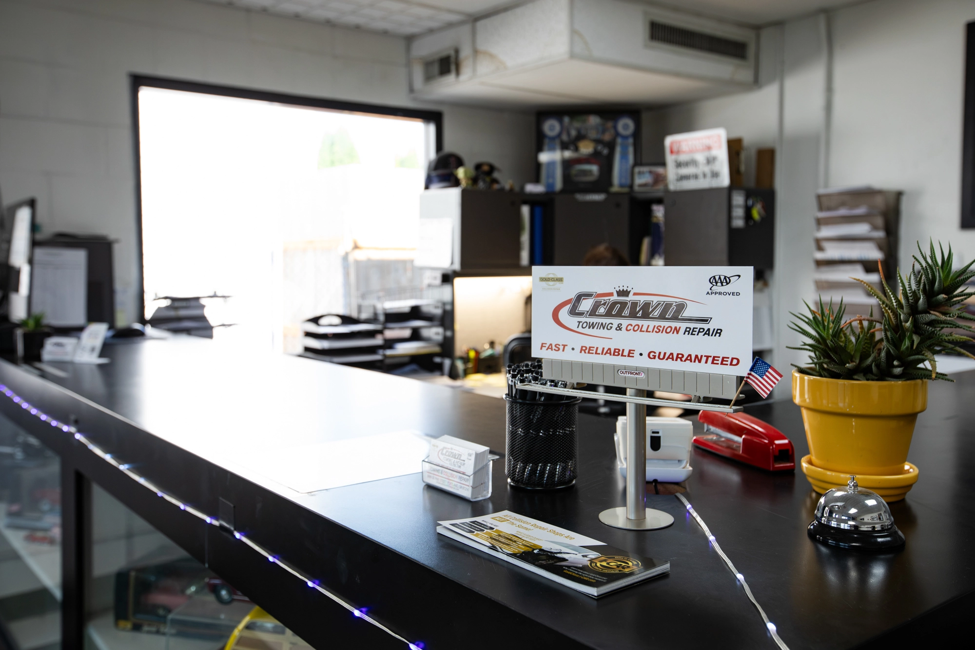 Crown Towing & Collision Repair front counter sign in Portland