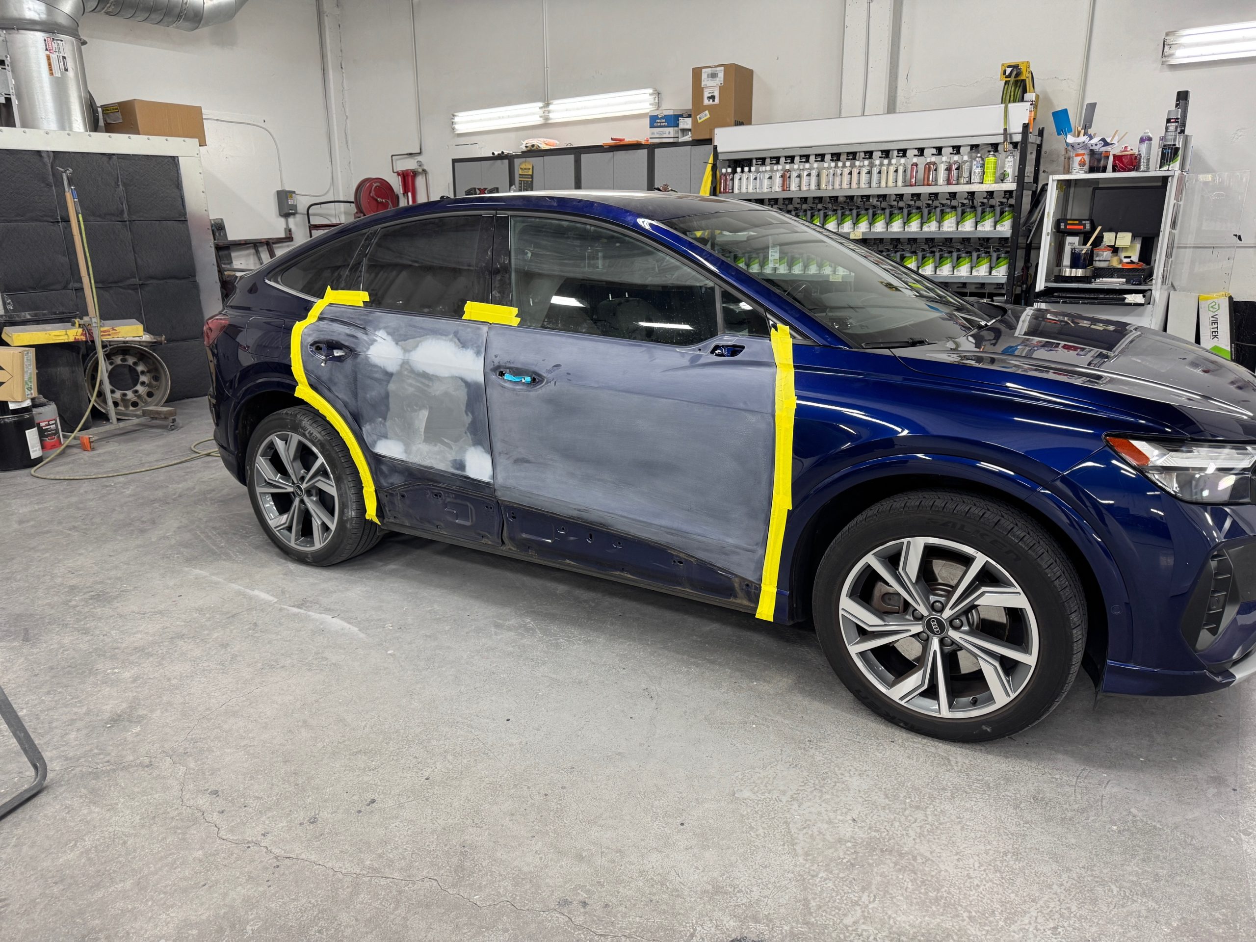 Auto body panel being sanded and prepped for paint at Crown Collision Repair in Portland