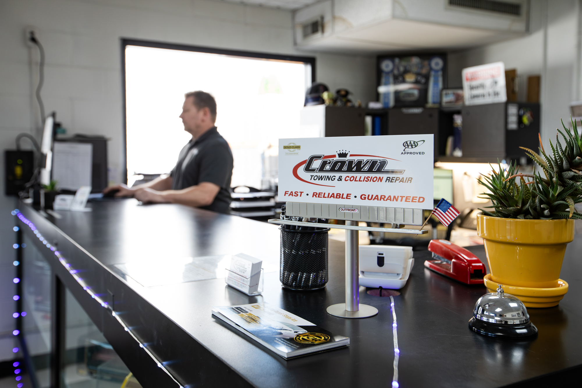 Front desk and customer reception area inside Crown Towing & Collision Repair's office