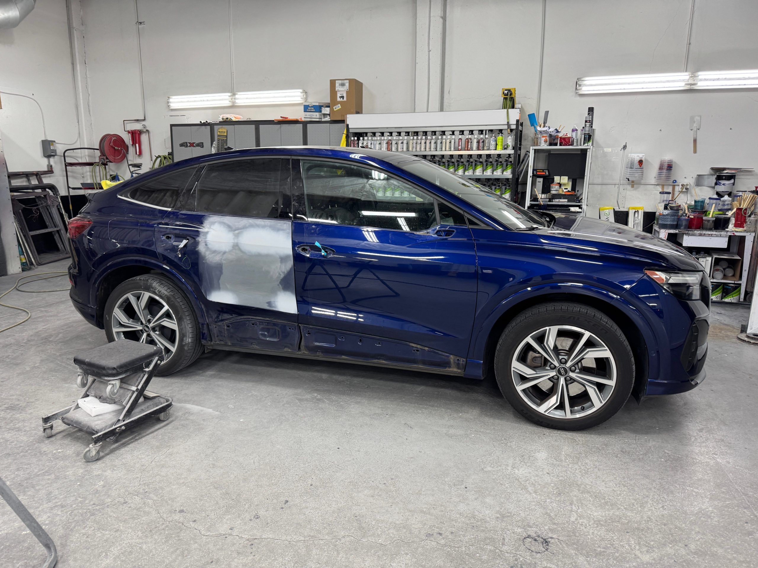 Frame and body alignment work in progress on a damaged car inside Crown's collision center